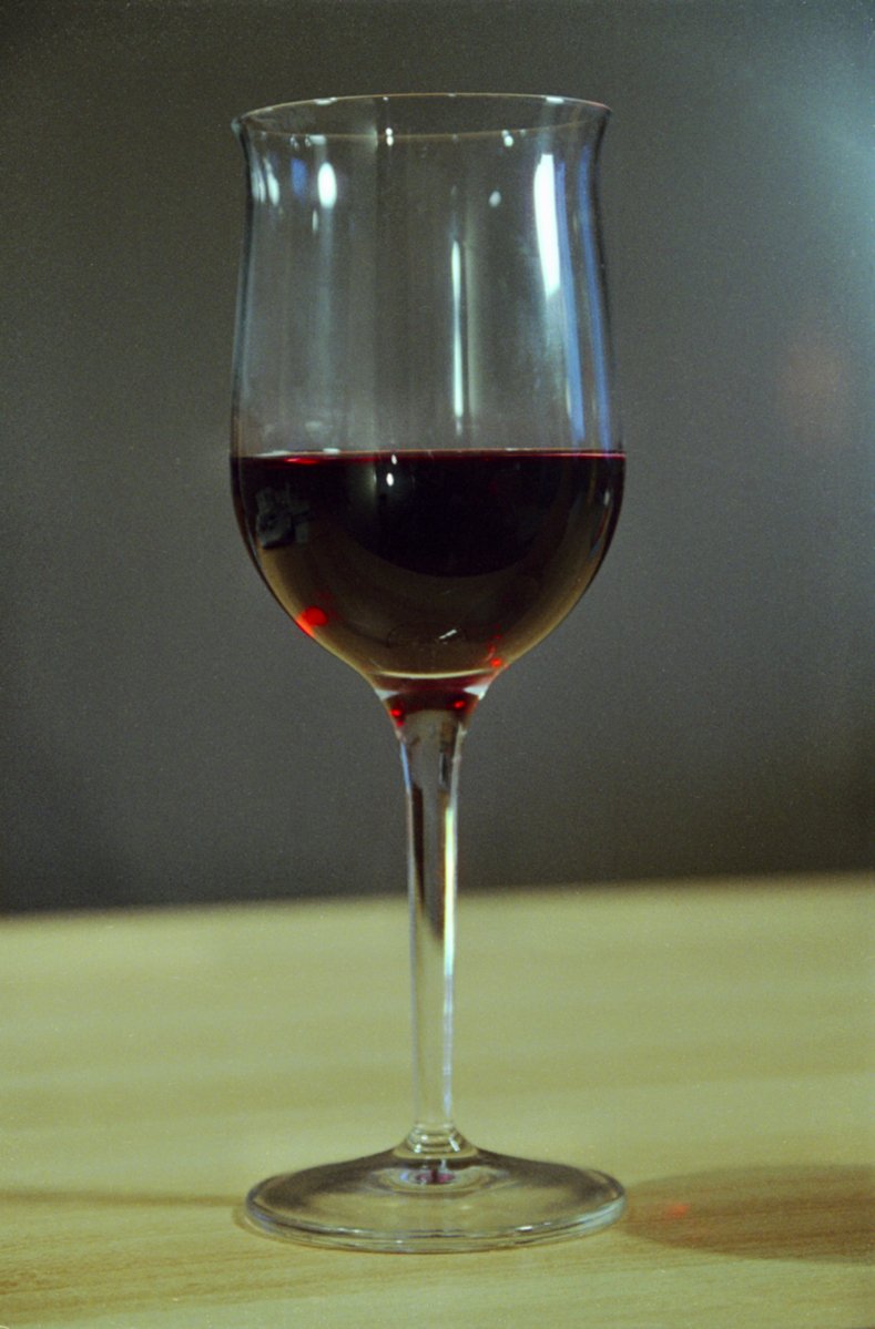 a close up of a glass with red wine