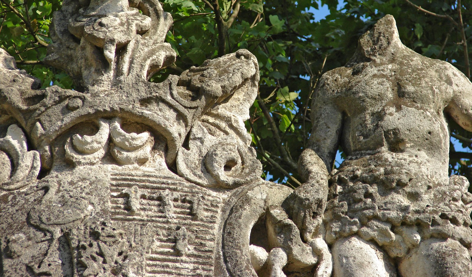 stone sculptures have ornate designs and leaves