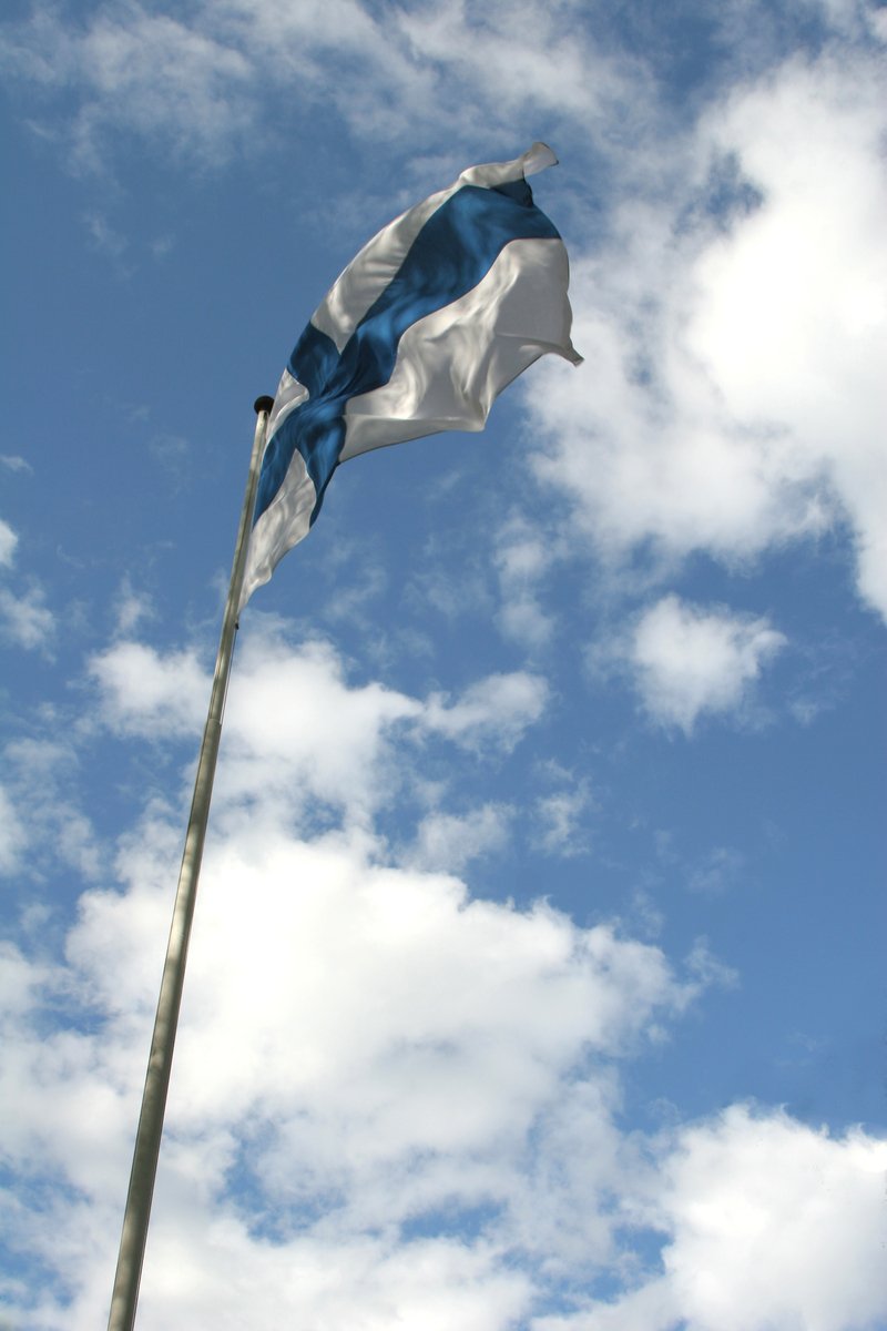 a flag flying on top of a flag pole