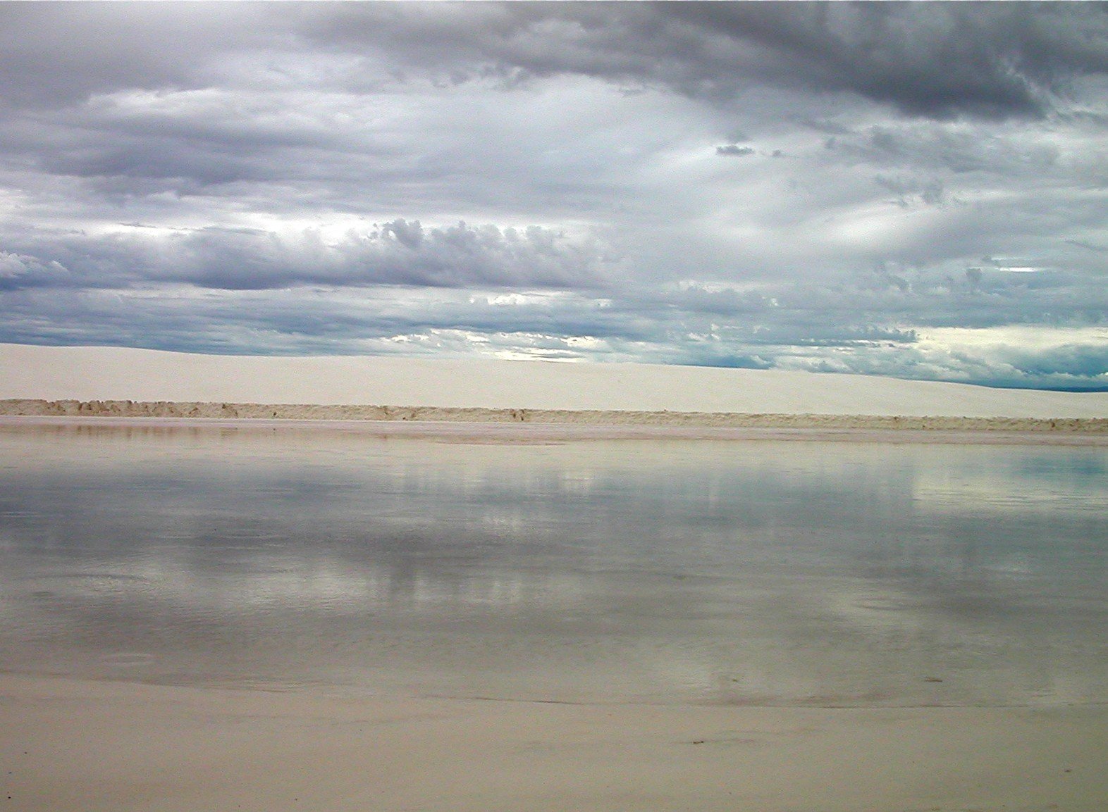 an ocean is covered with clouds during the day