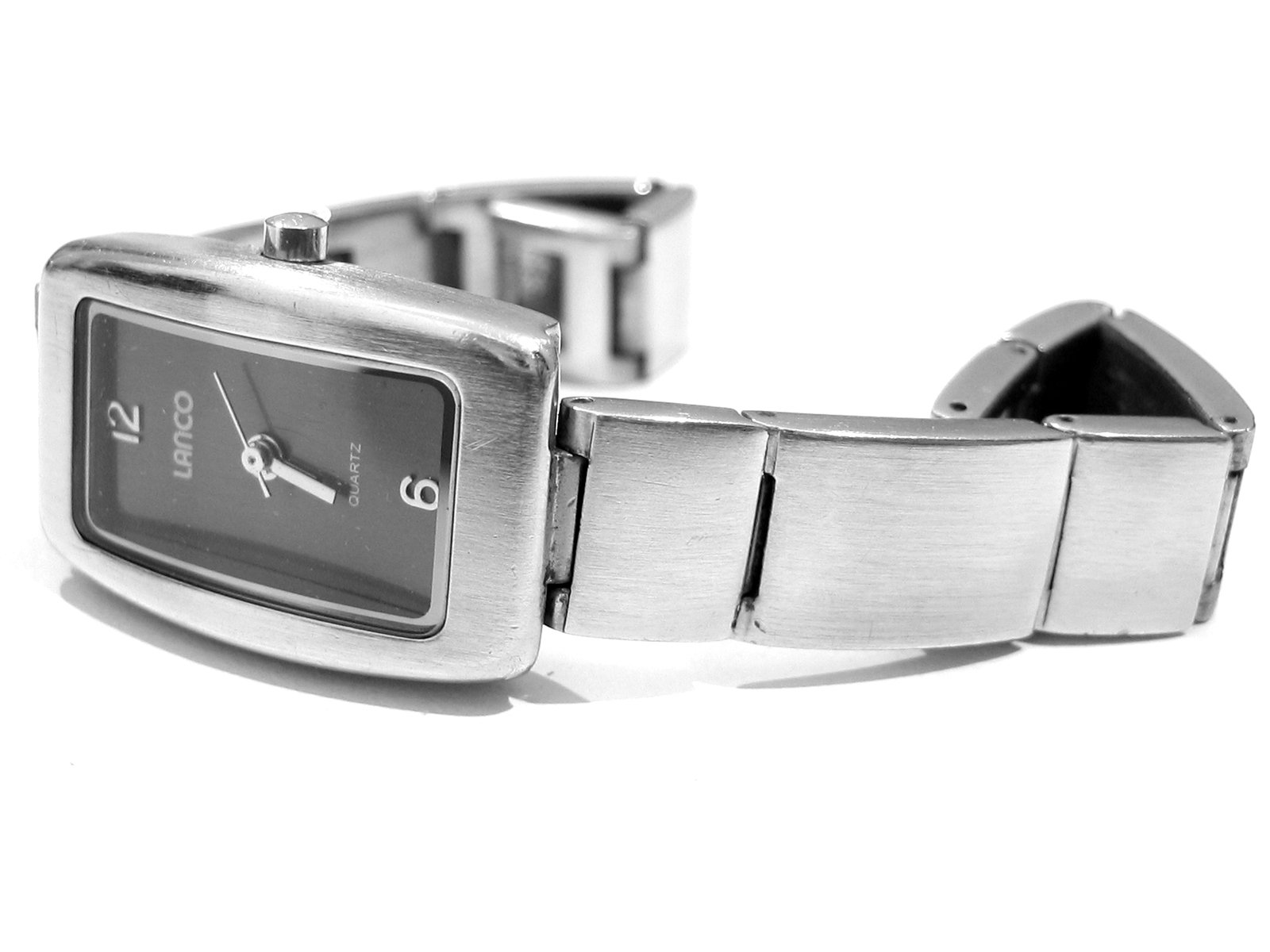 the square watch is silver and has a black face