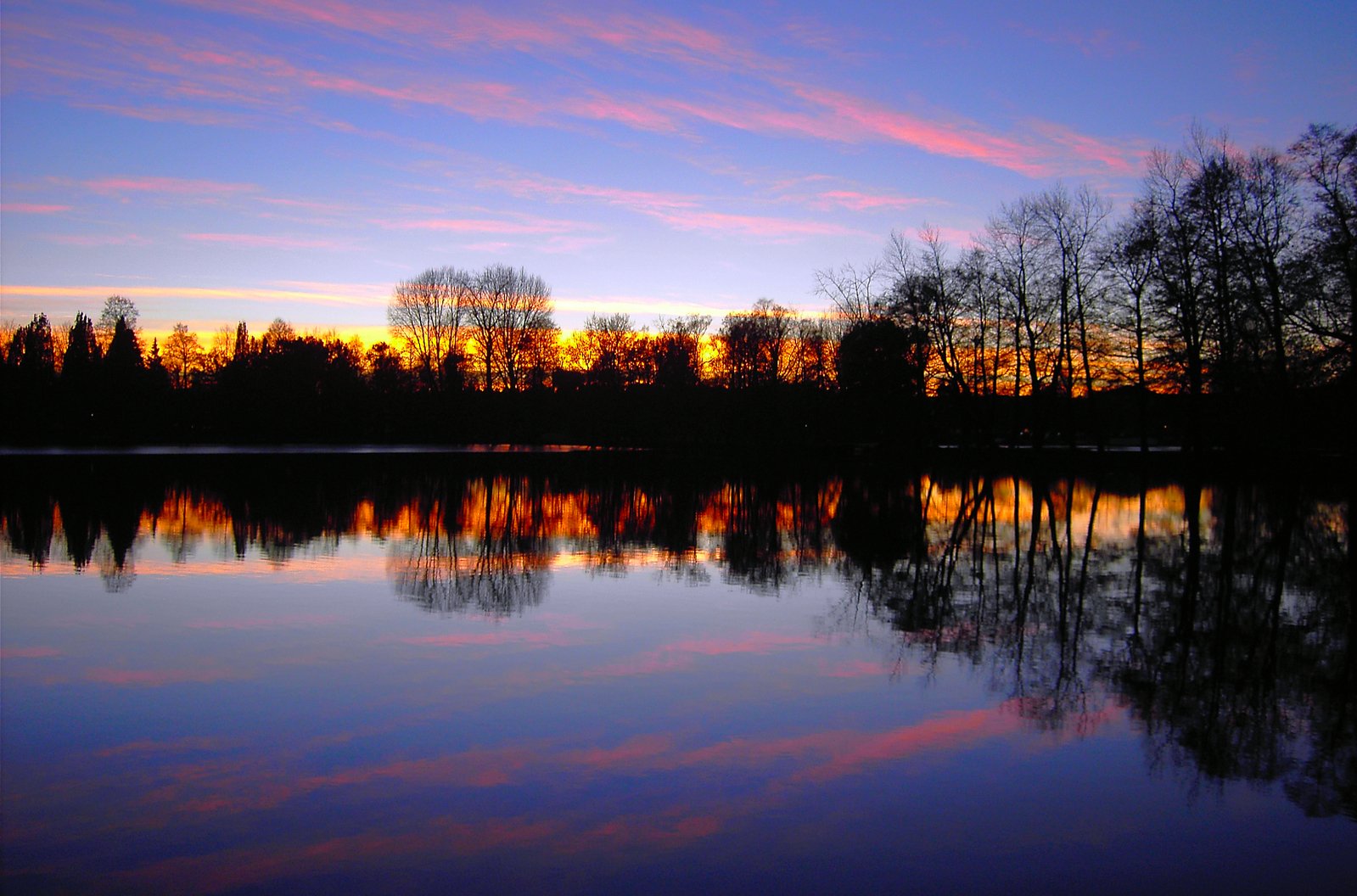 the sky has been reflected in a still lake