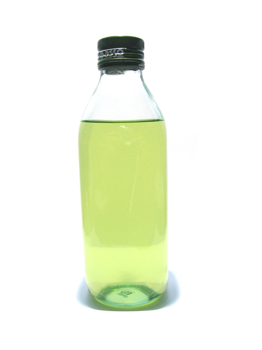 the green plastic bottle is full of liquid
