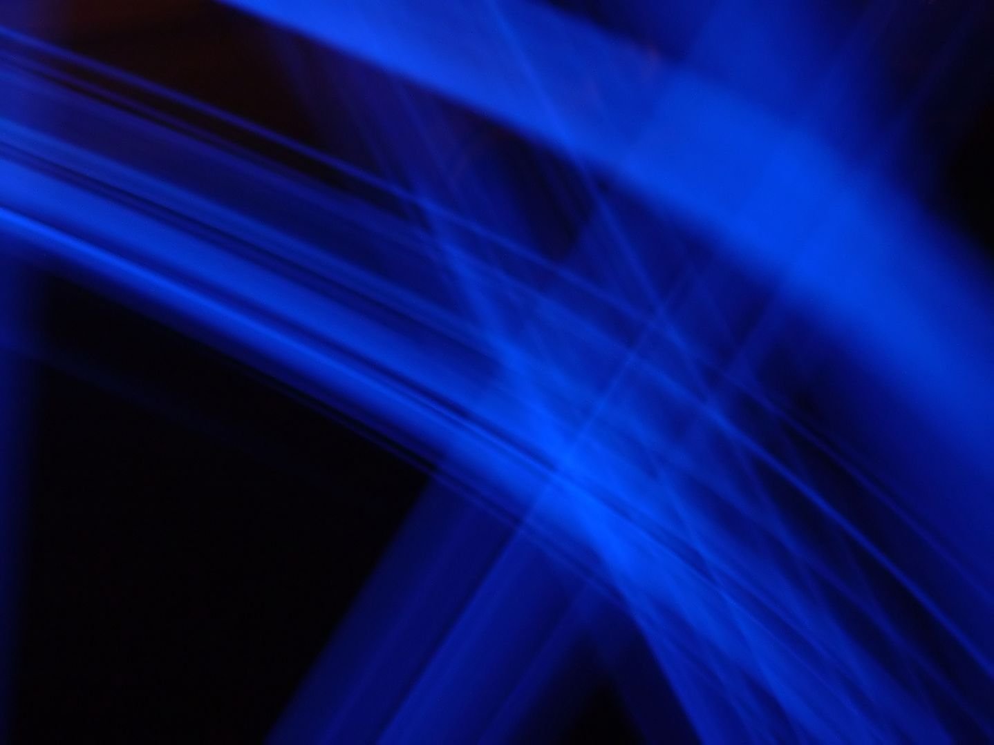 a blurry image of a bright blue abstract line