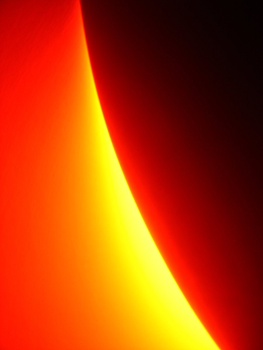 a closeup of a curved light beam at dusk