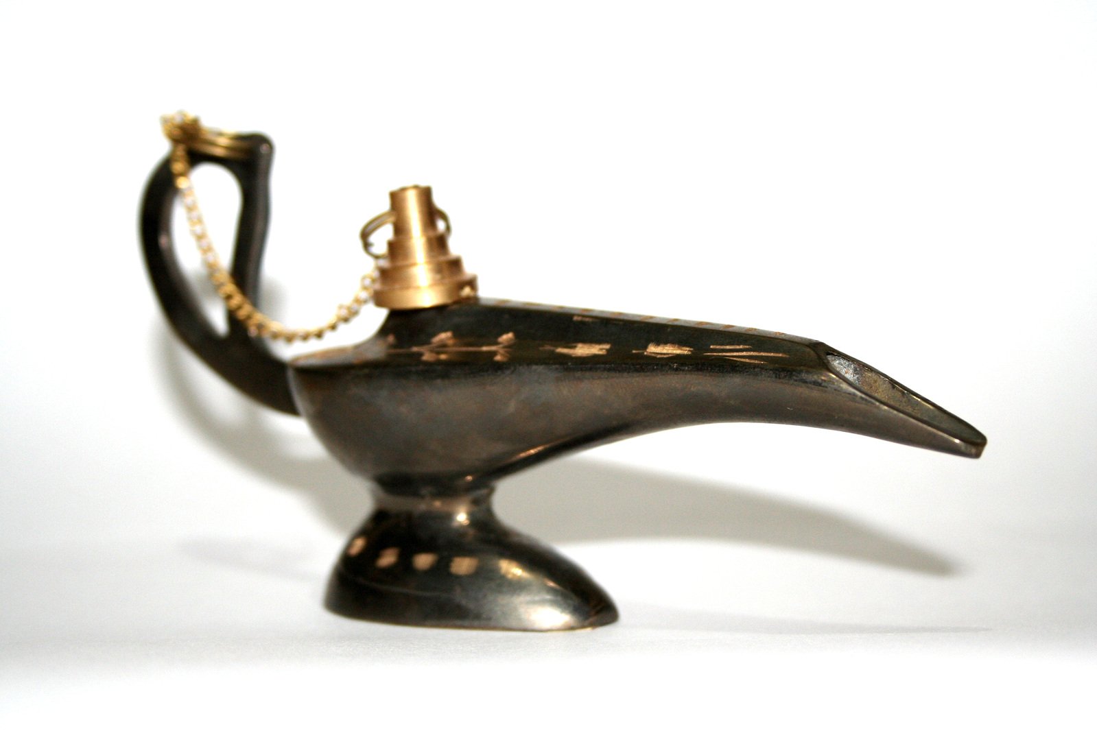 a black bird made from an old gold piece