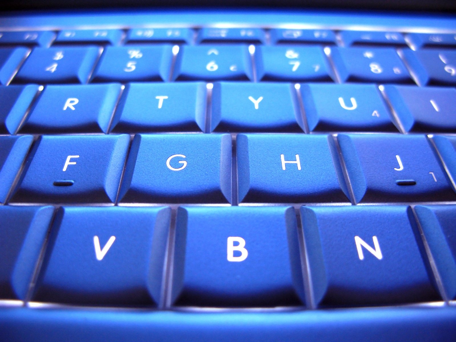 blue keyboard showing two small, small letters