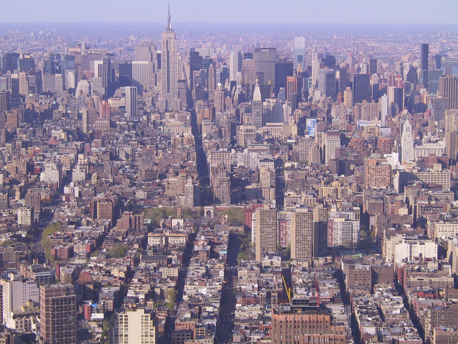 an aerial view of a city from the top of a tall building