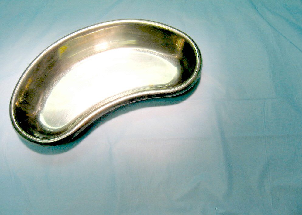 a silver tray is set on top of blue fabric