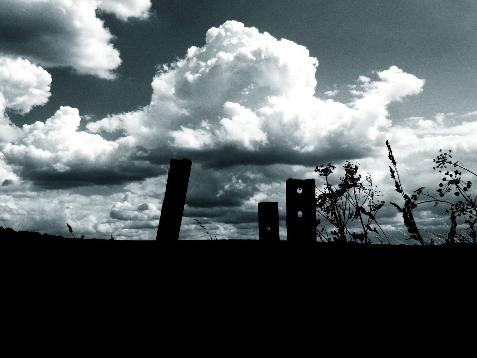 an image of a black and white picture with the clouds above