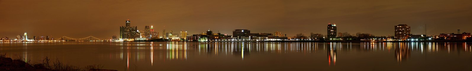 a night time view of some lights on the water