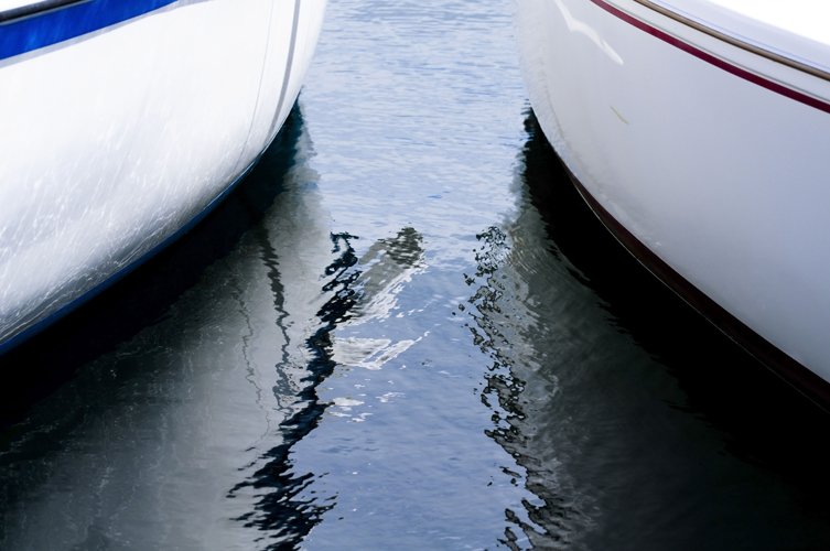 two large boats side by side in the water