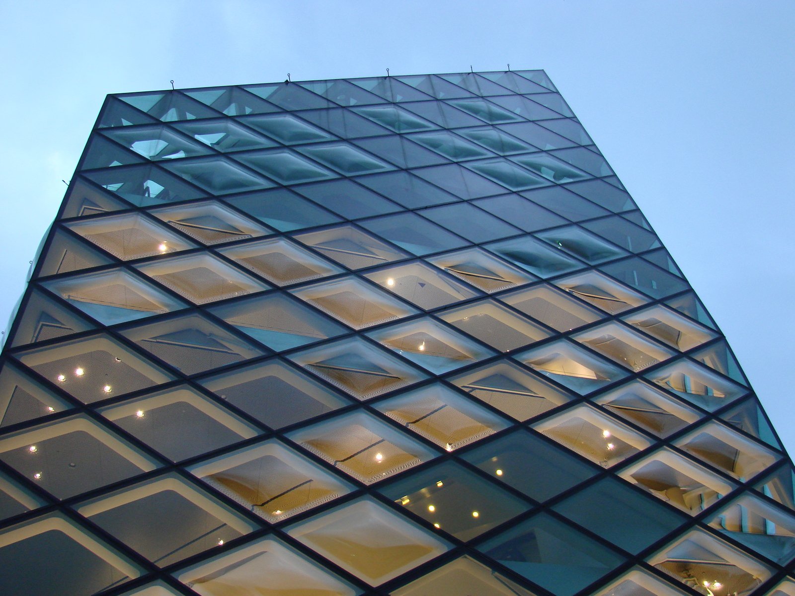 a tall glass building that has many windows