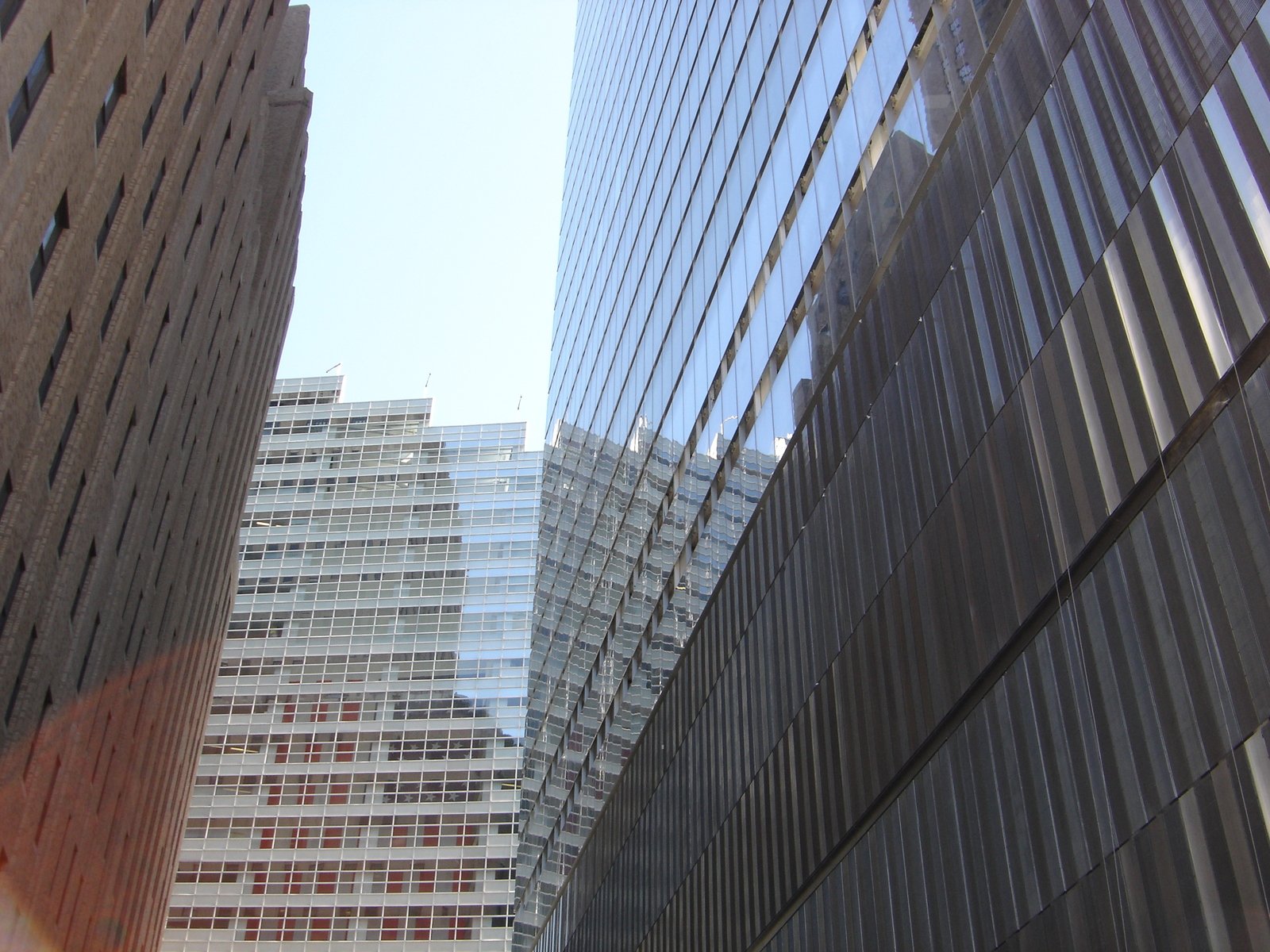 several buildings with skyscrs in the background