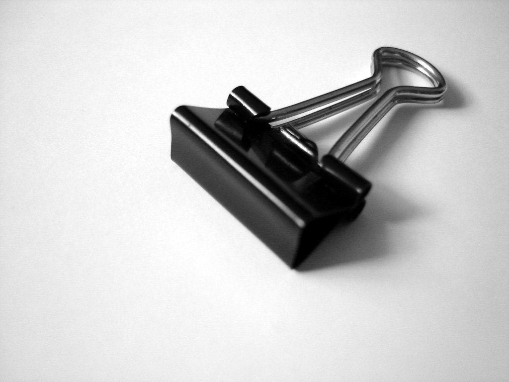 a black and white image of a metal object
