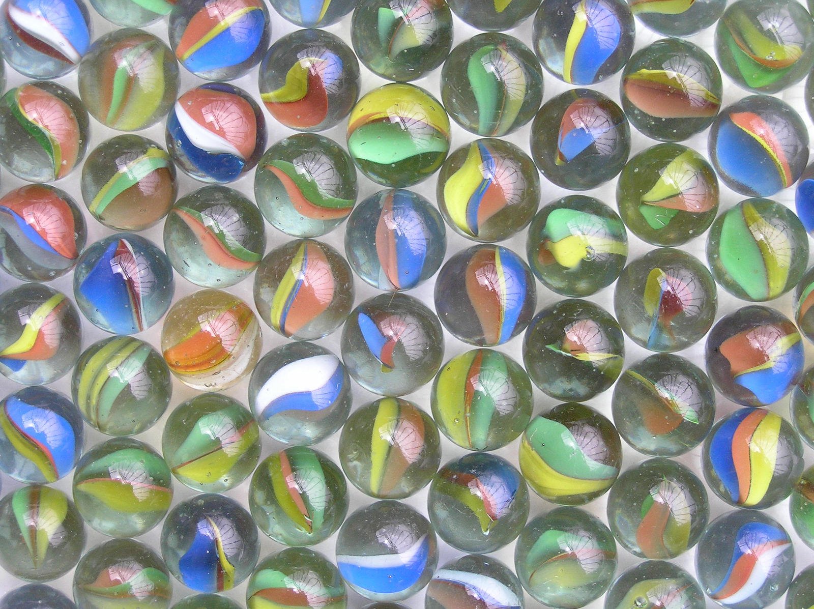 multicolored marbles on white background a mosaic image