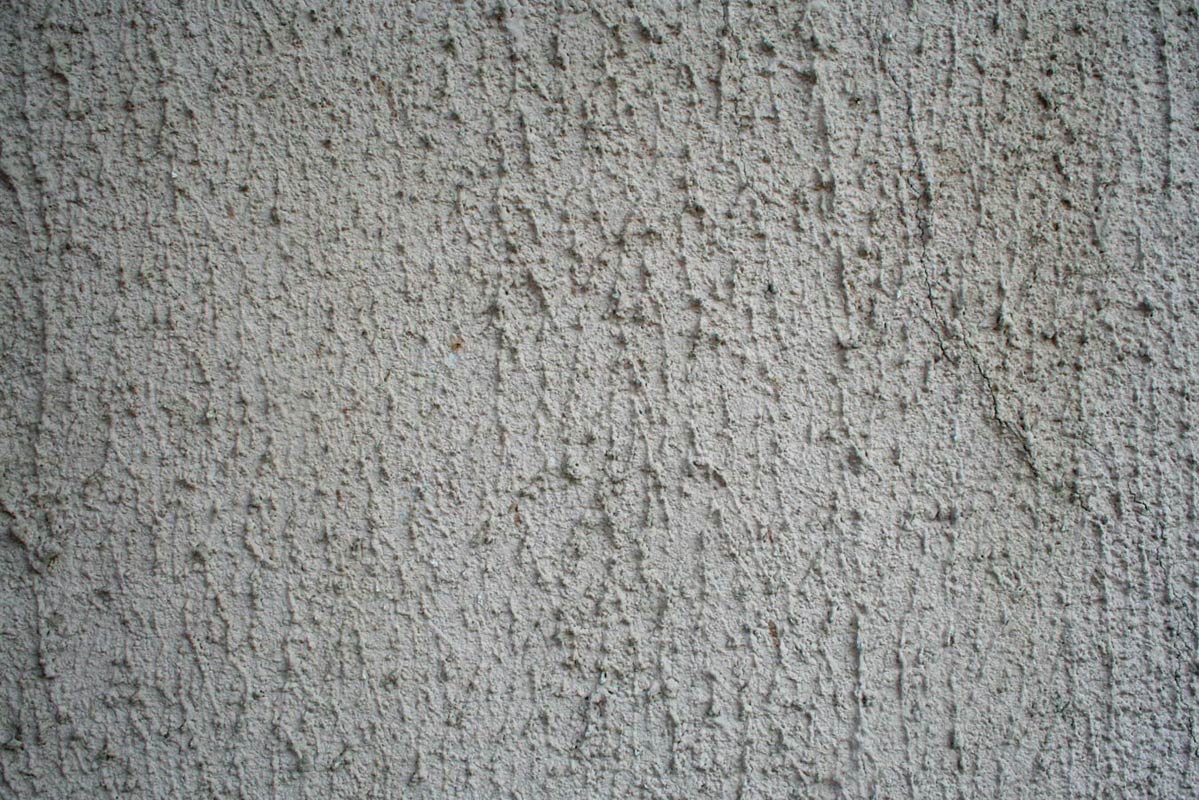 the textured concrete is white and has small scratches