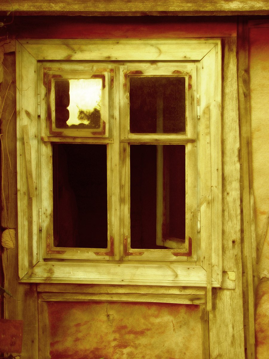 a pograph of the old wooden window with glass panes