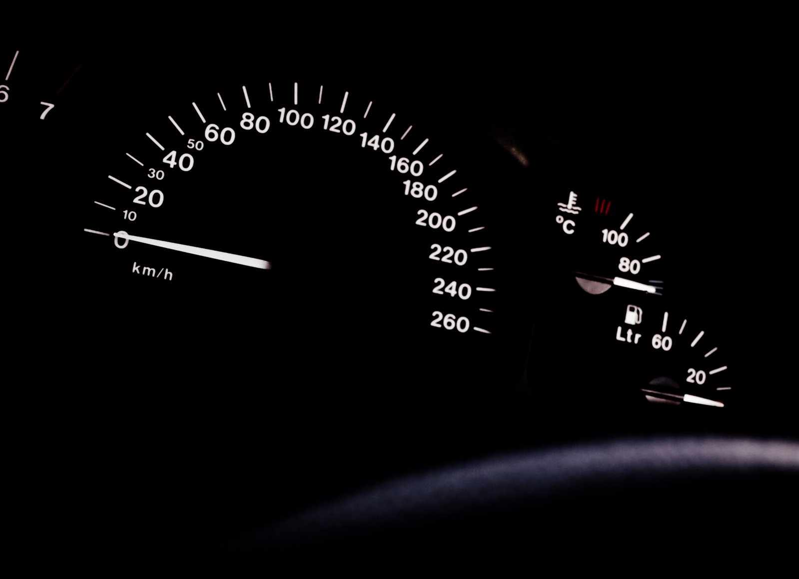 the instrument gauges on a vehicle are shown at night