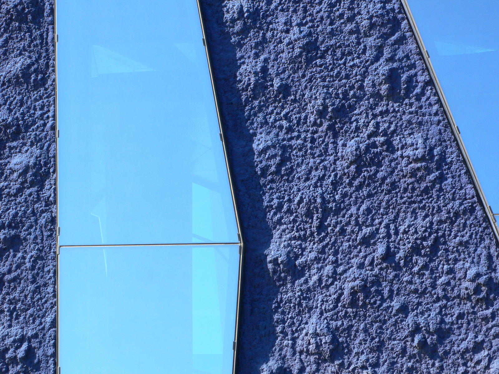 there is a close up view of a blue wall