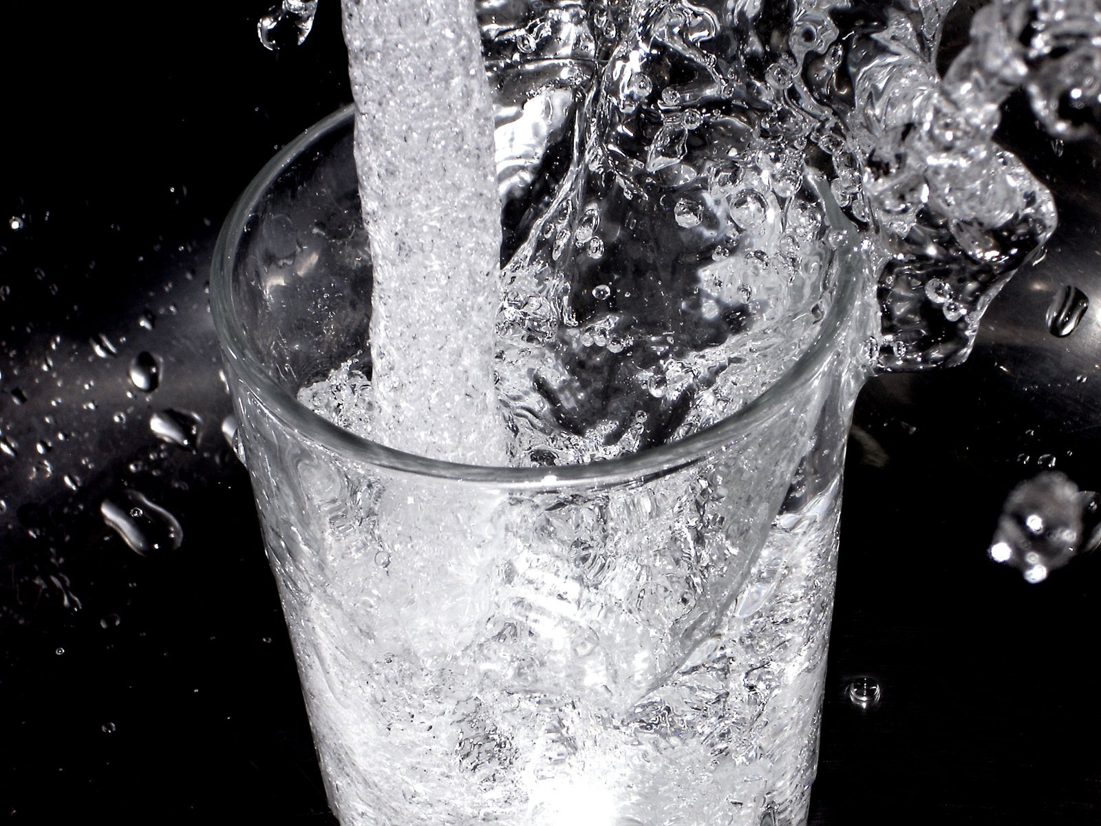 a ice cube that has dropped into a glass