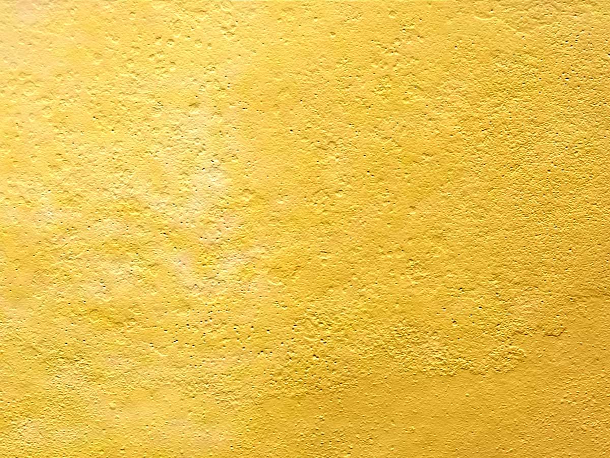 a light yellow background that has the corner of the wall painted