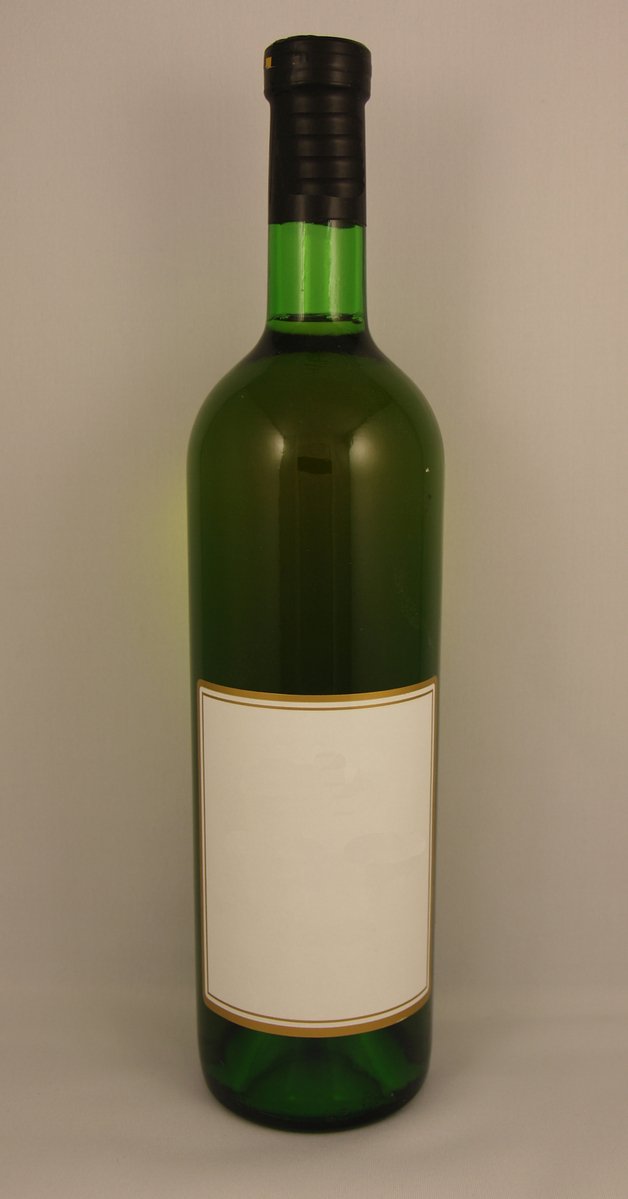 a bottle of wine with white label sitting in front of a gray background