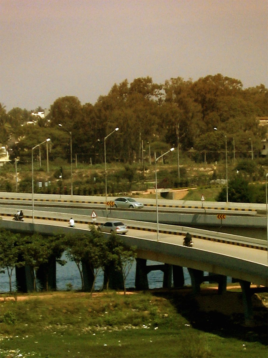 cars travel on a freeway over a river