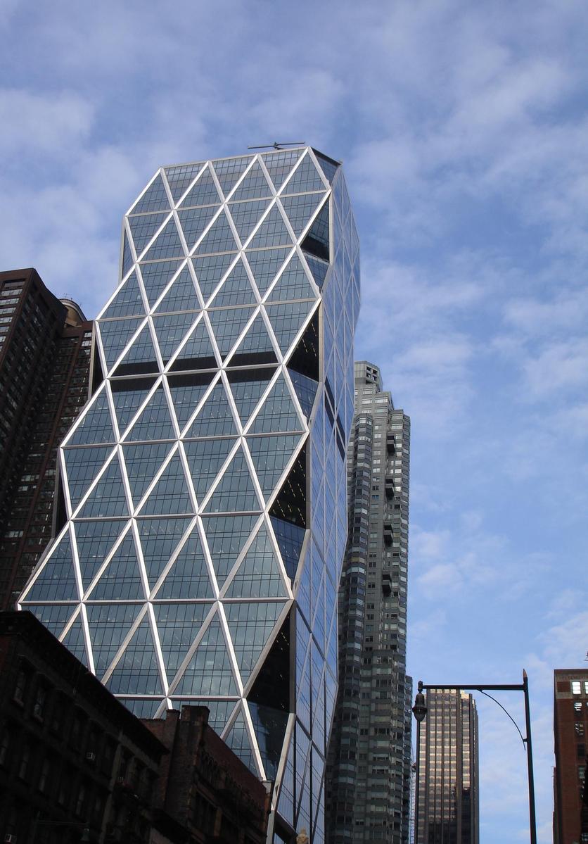 the view of tall buildings against the blue sky