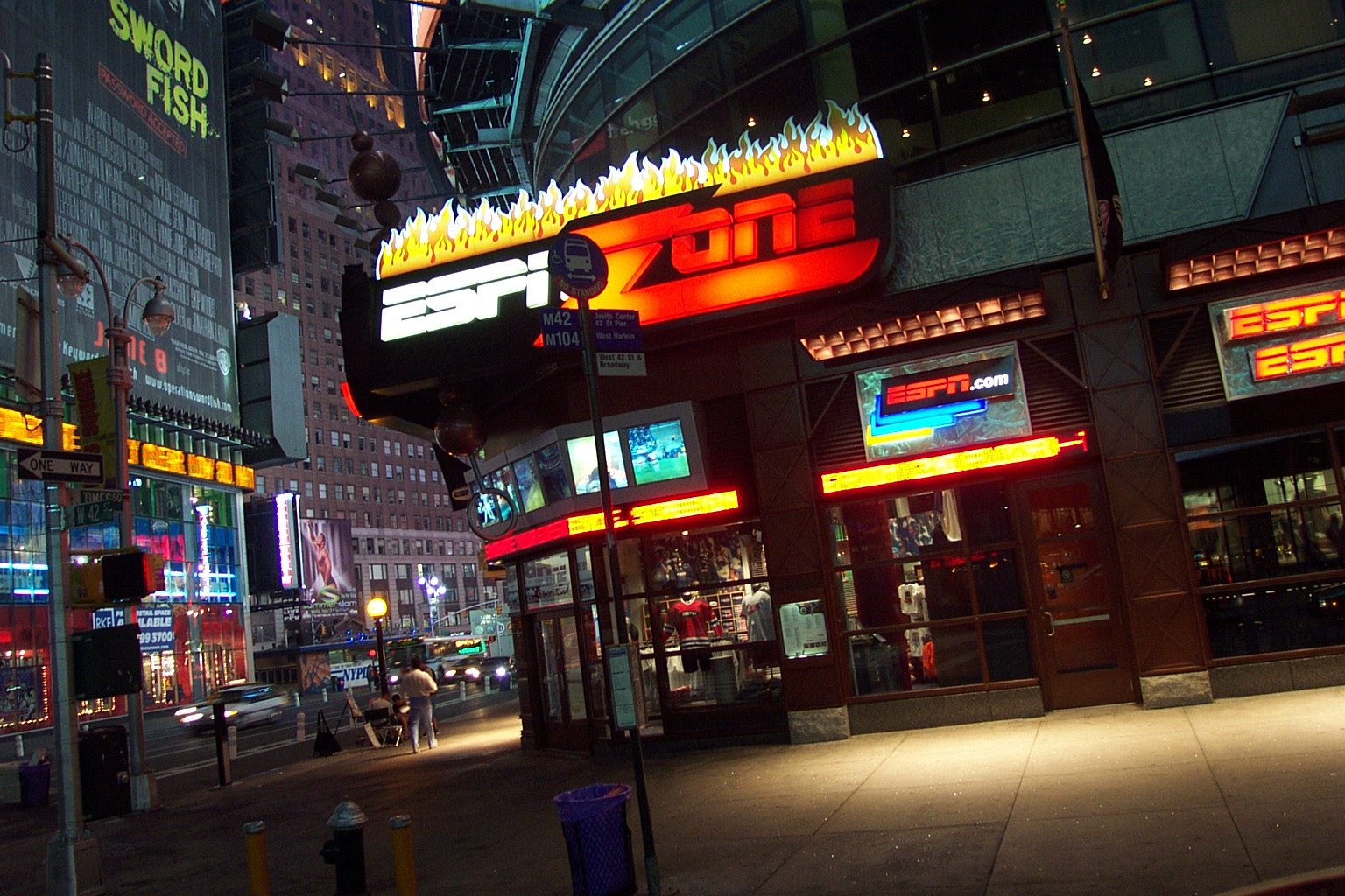 several buildings at night in a crowded city