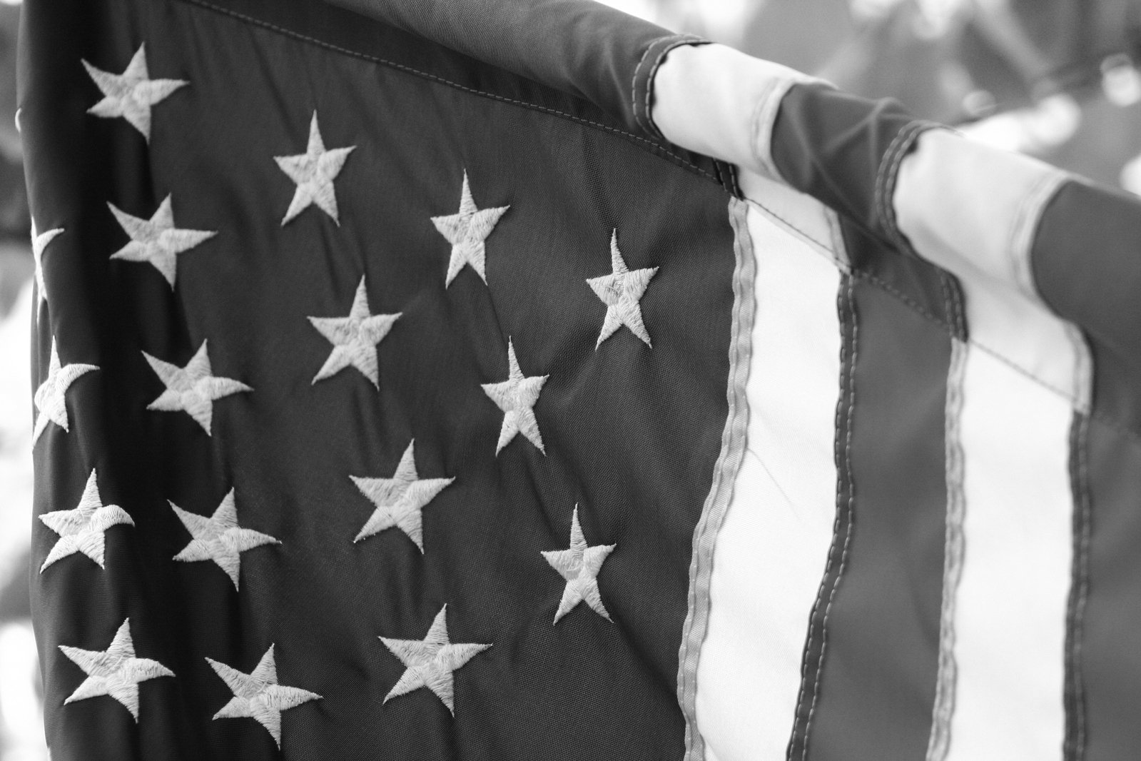 the american flag hanging up in black and white