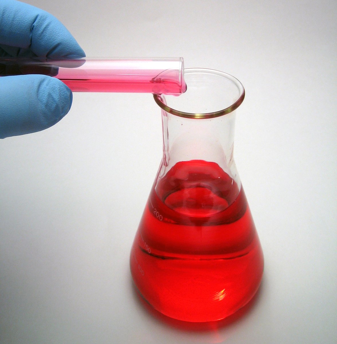 a test tube with a liquid filled with red liquid