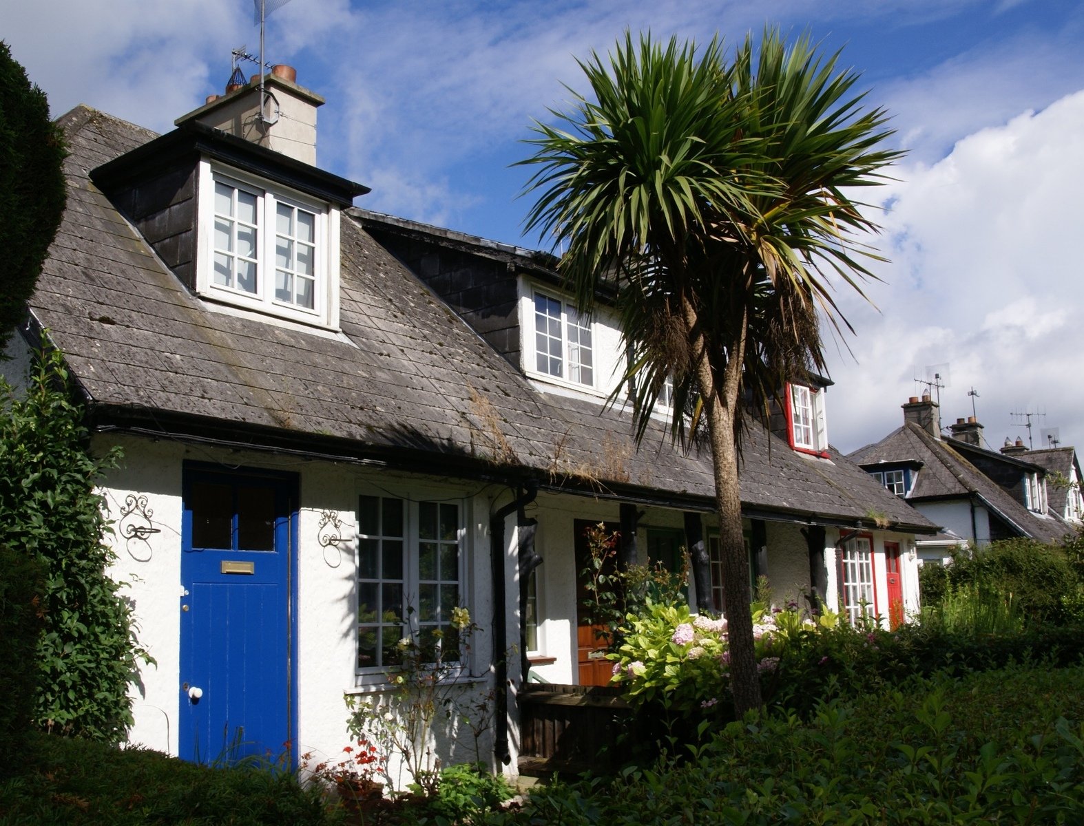 a house with a blue door and windows