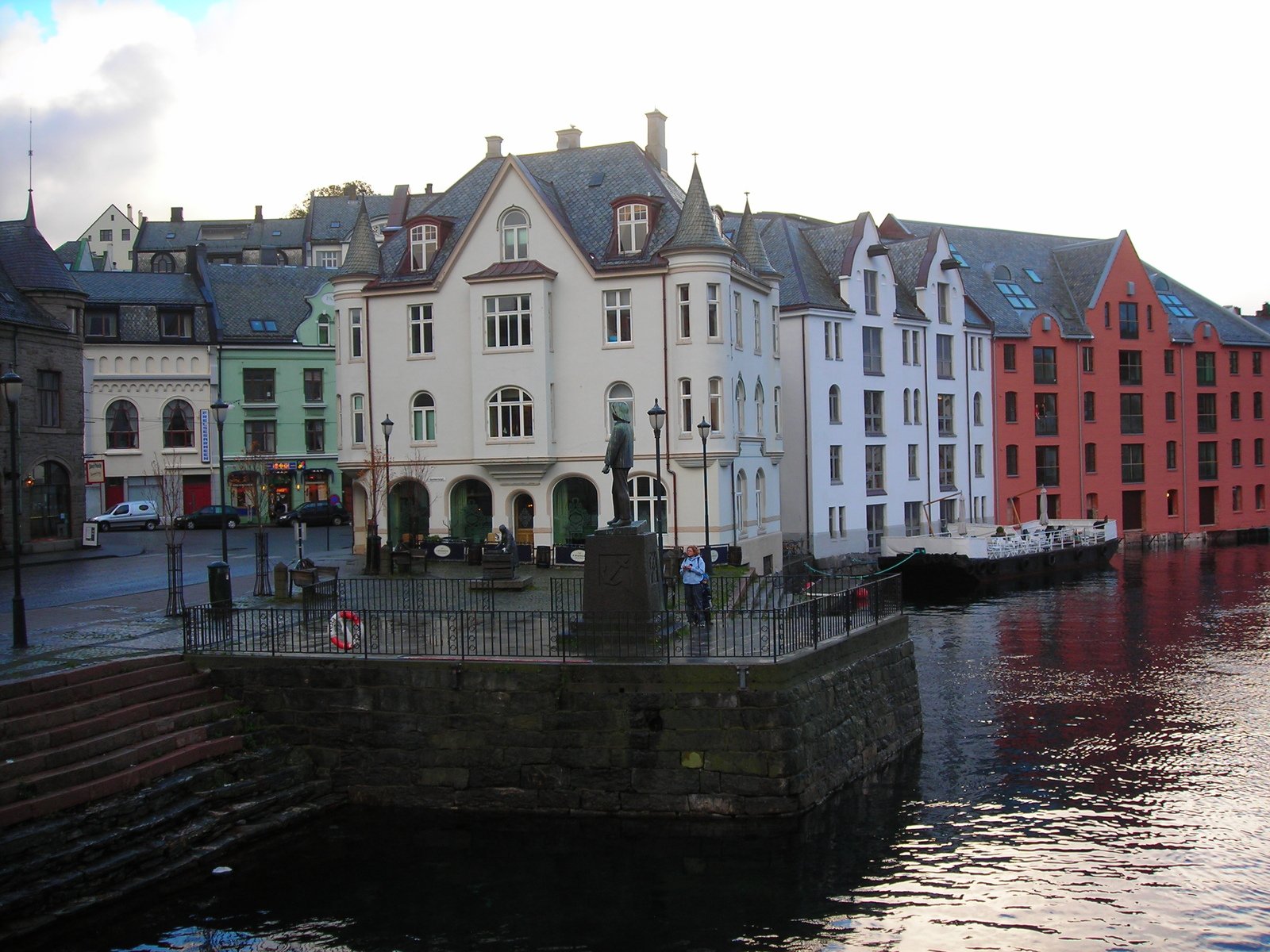 row of buildings at the river's edge overlooking several other water features