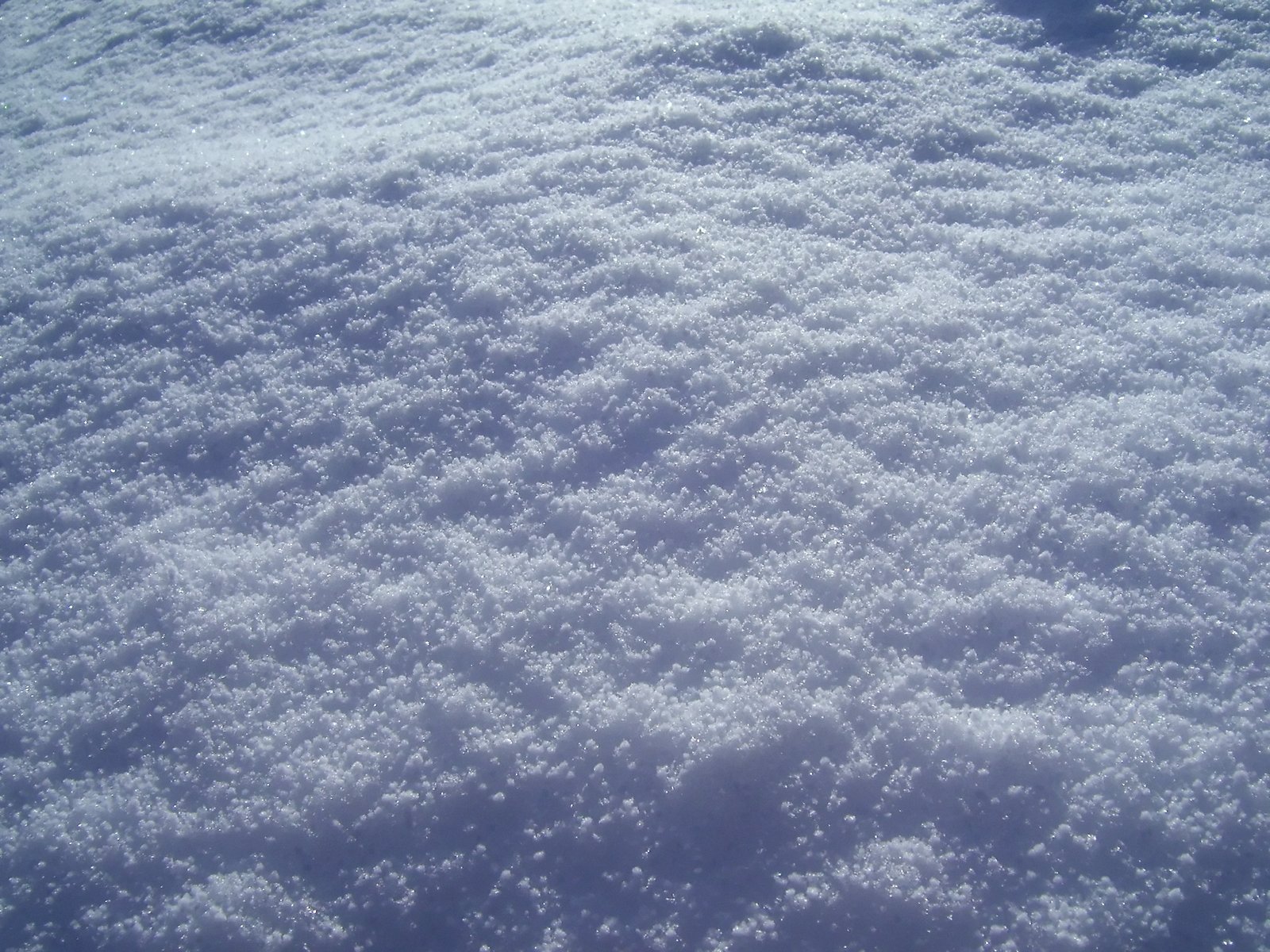 an image of snow covered ground as seen from above