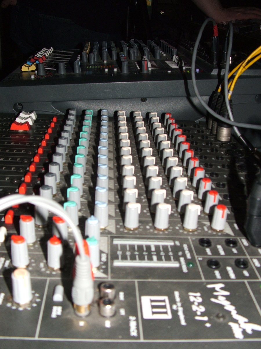 an electronic mixing board with different colored s