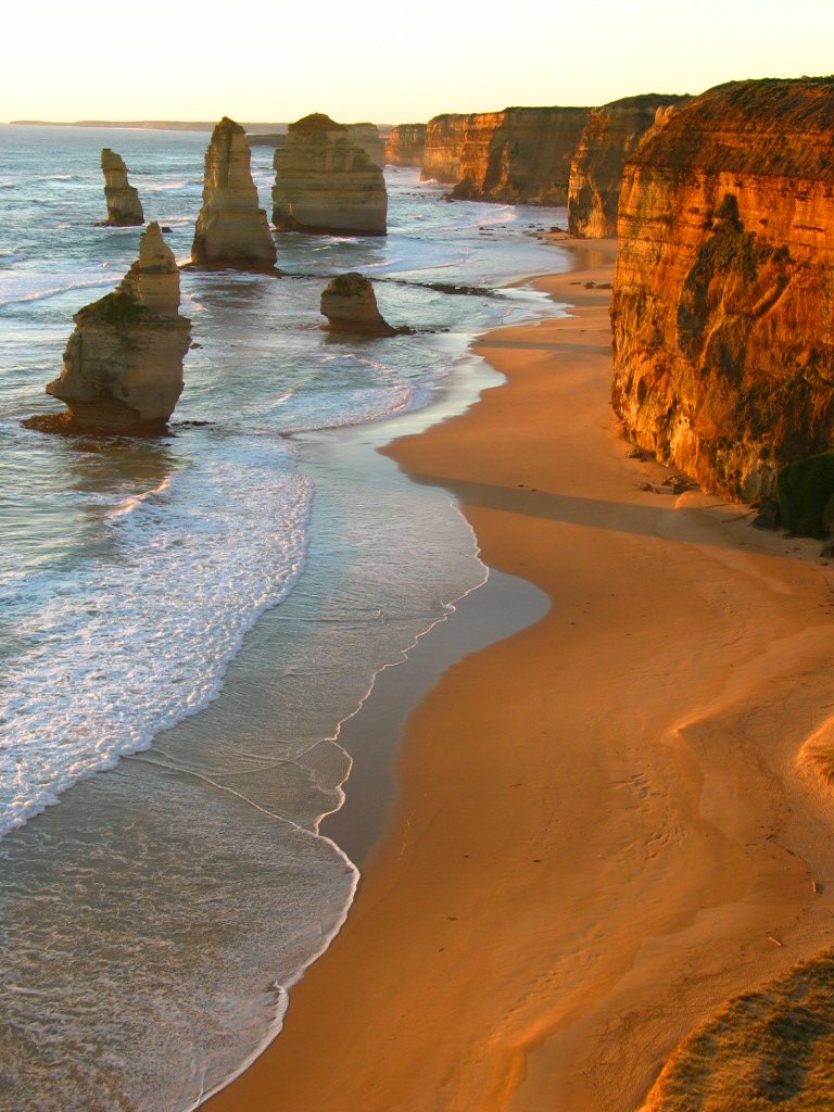 an aerial view of some cliffs at a beach