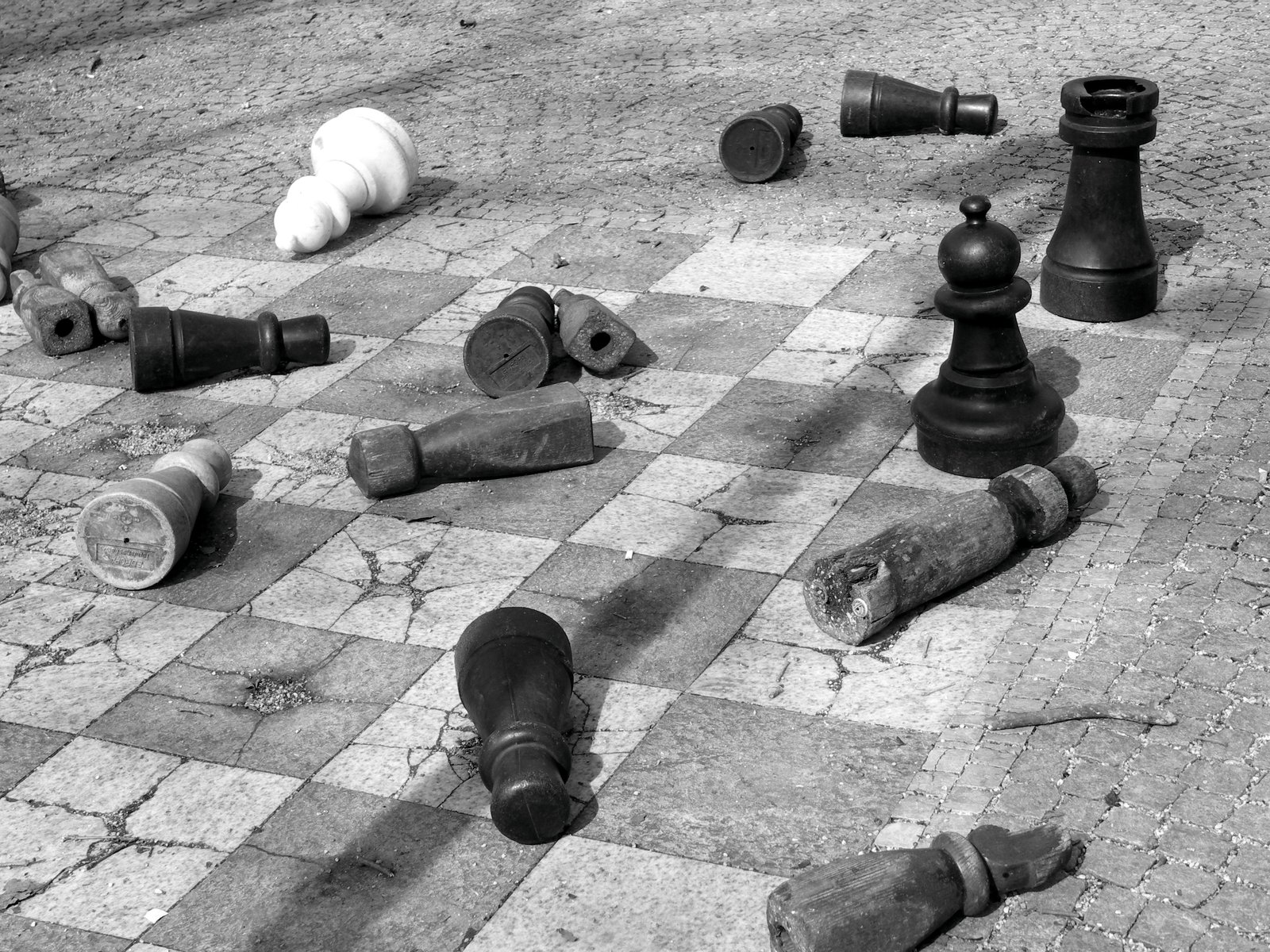 black and white pograph of many old chess pieces