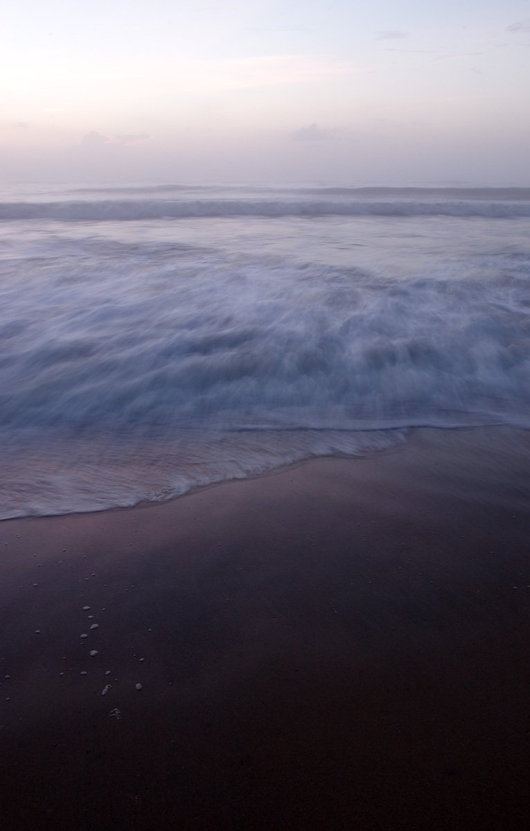 there are no waves on the beach but it is very clear