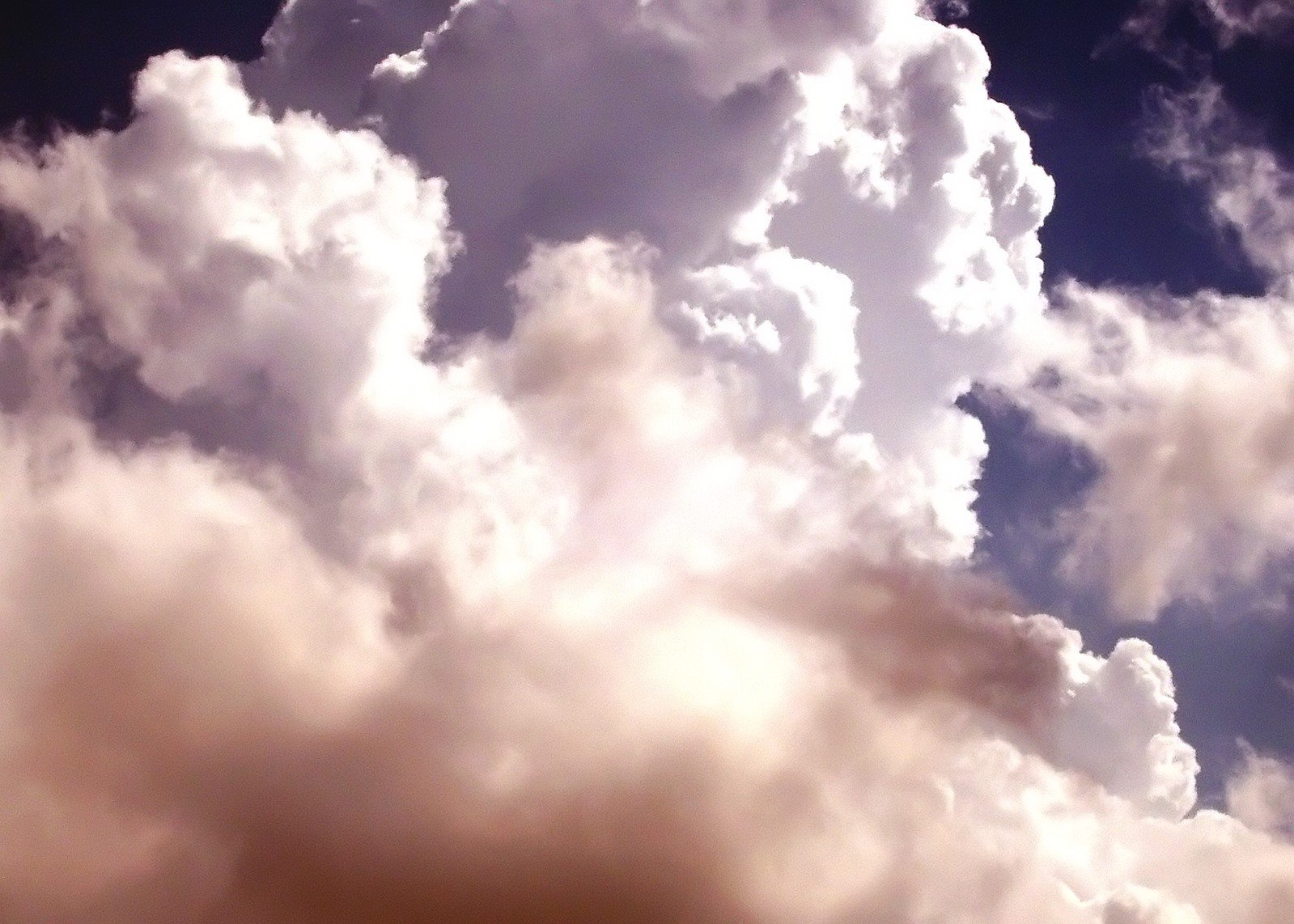 a cloudy sky that is full of blue and white clouds