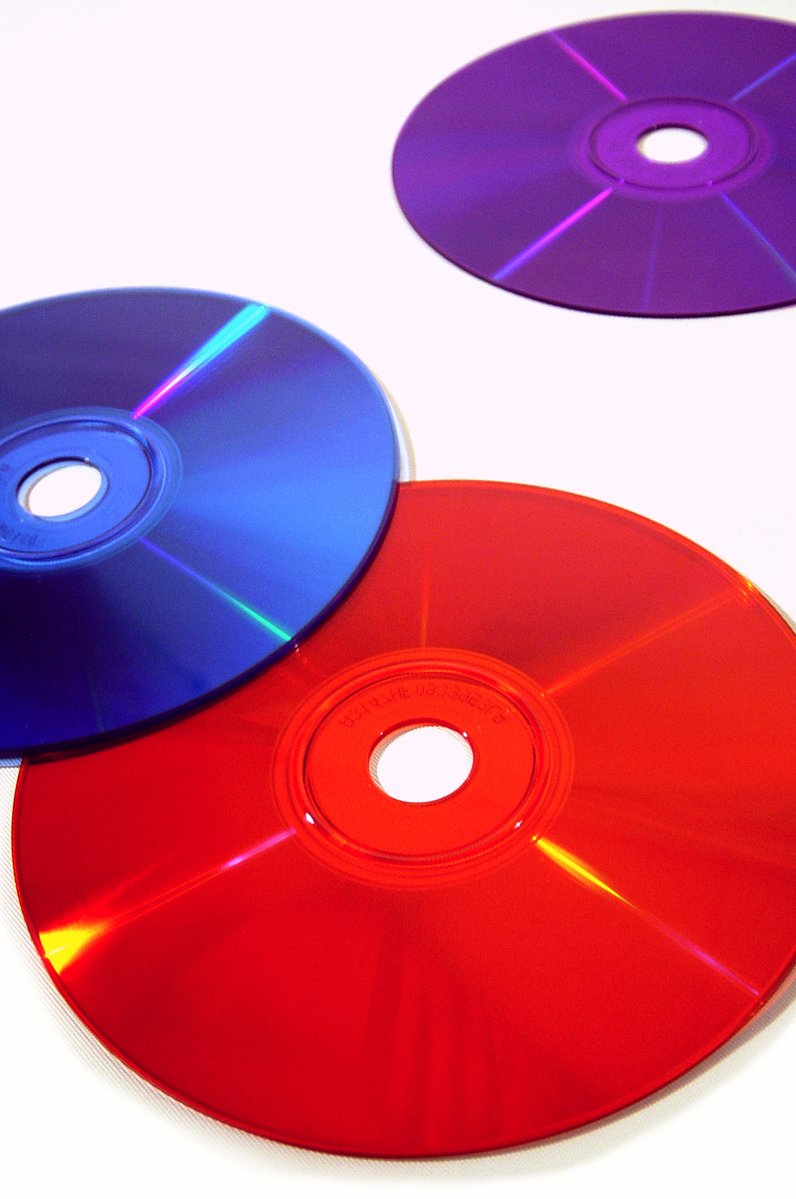 two colored cds in a close up view