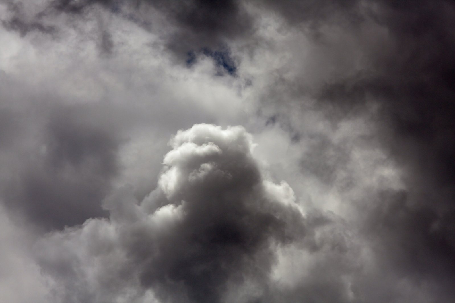 some clouds that are gray and white and one is cloud