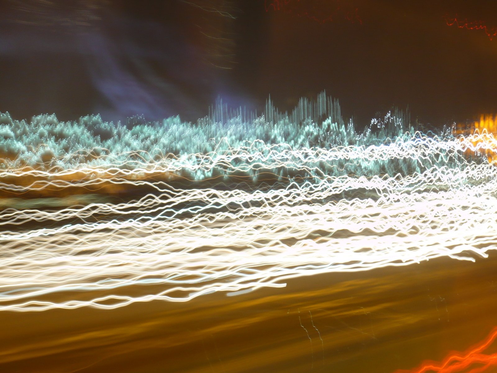 a group of motion blurs are seen in the dark