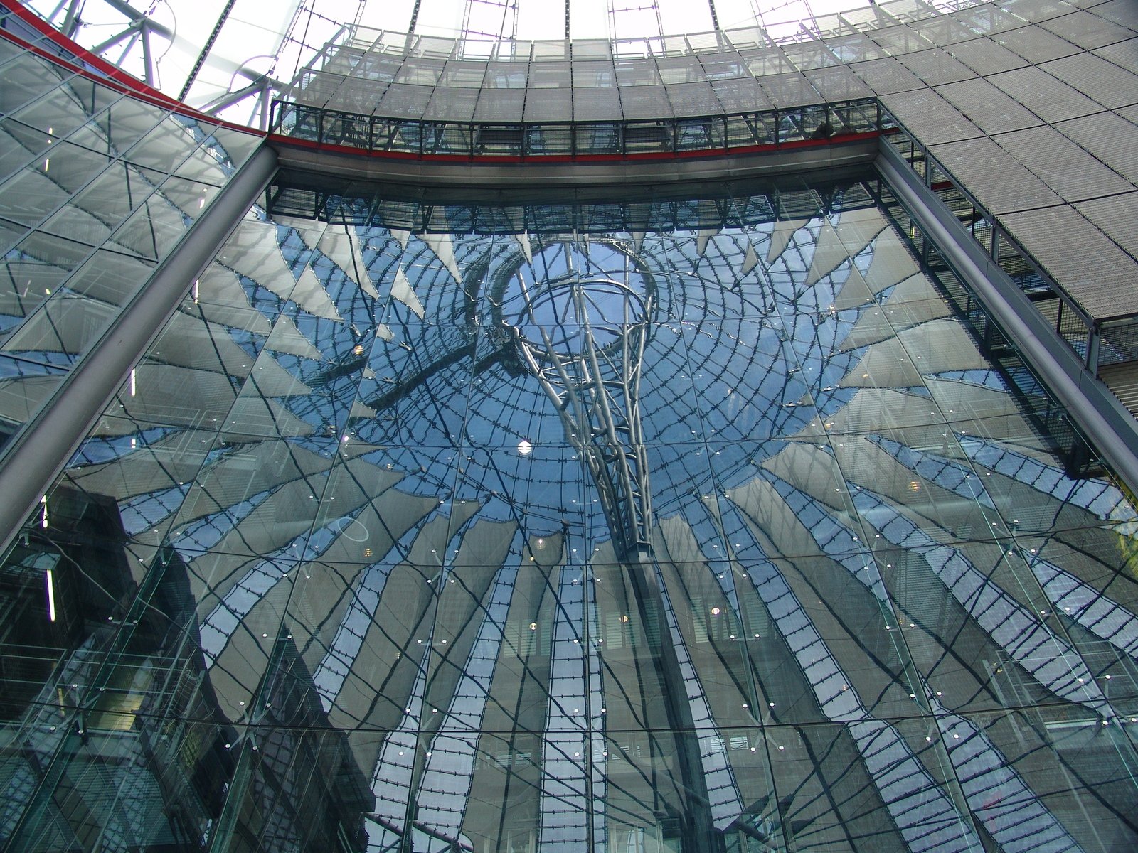 a very large and futuristic building with glass floors