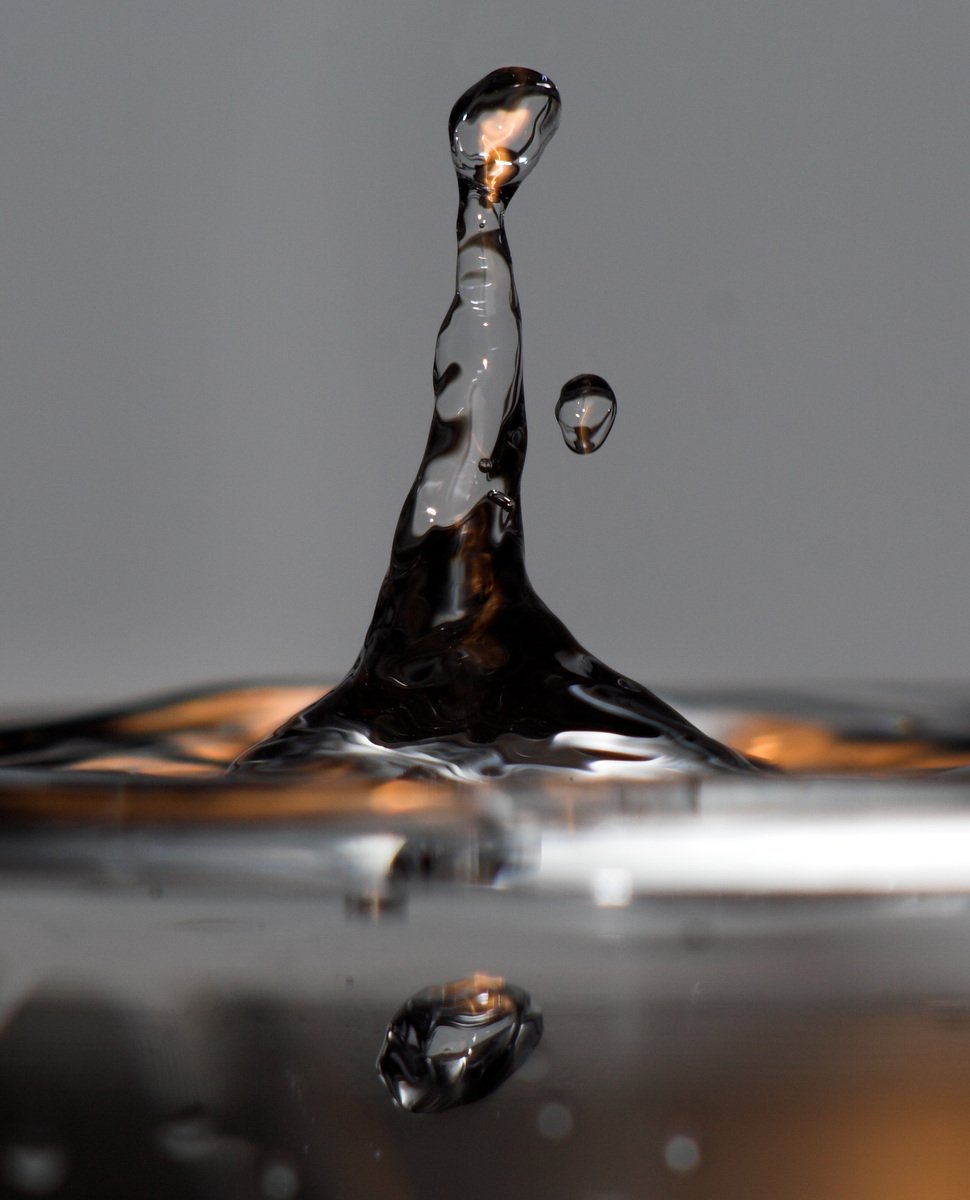 water falling into the air with some bubbles