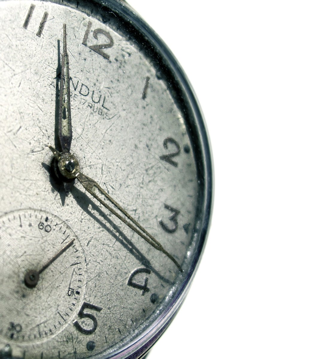 a close up view of a clock in front of a white background