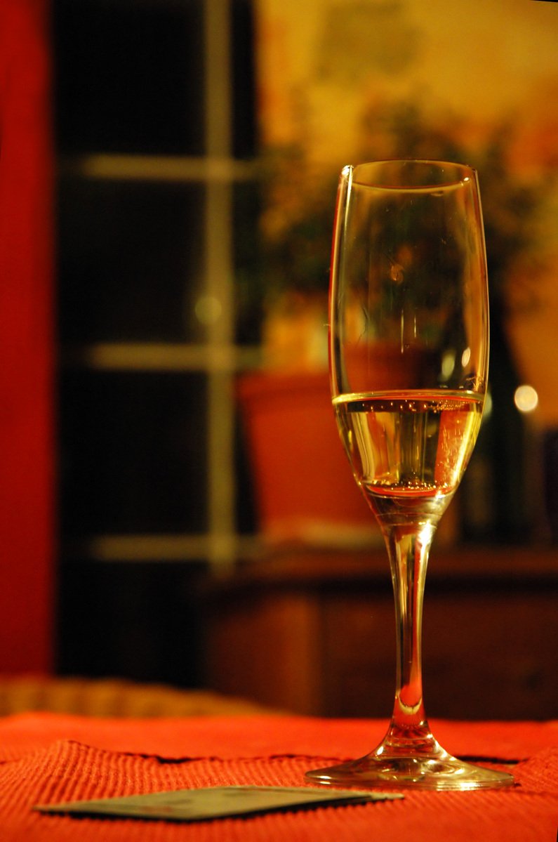 a wine glass on the table sitting on the table