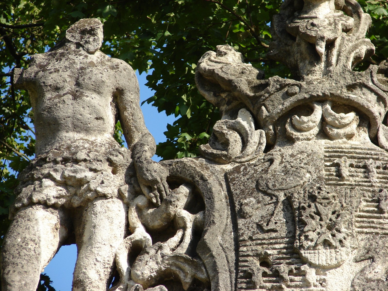 a large stone statue with a man on the back