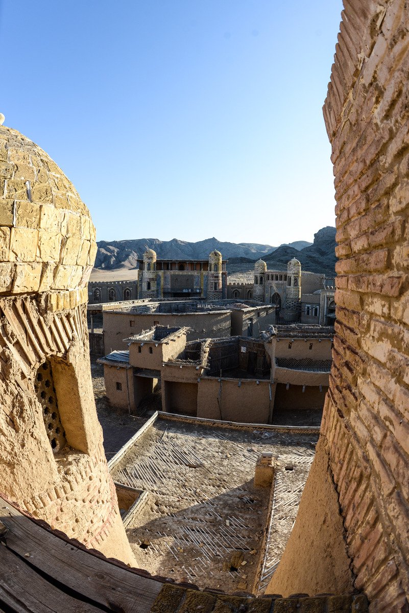 the wall on the left is an old village with little buildings