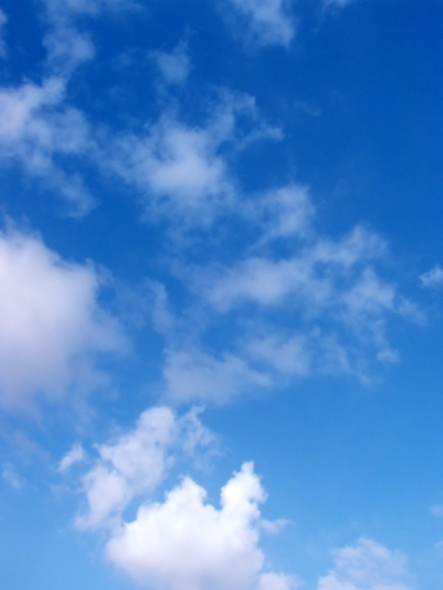 a po of a sky with clouds taken from a ground level s